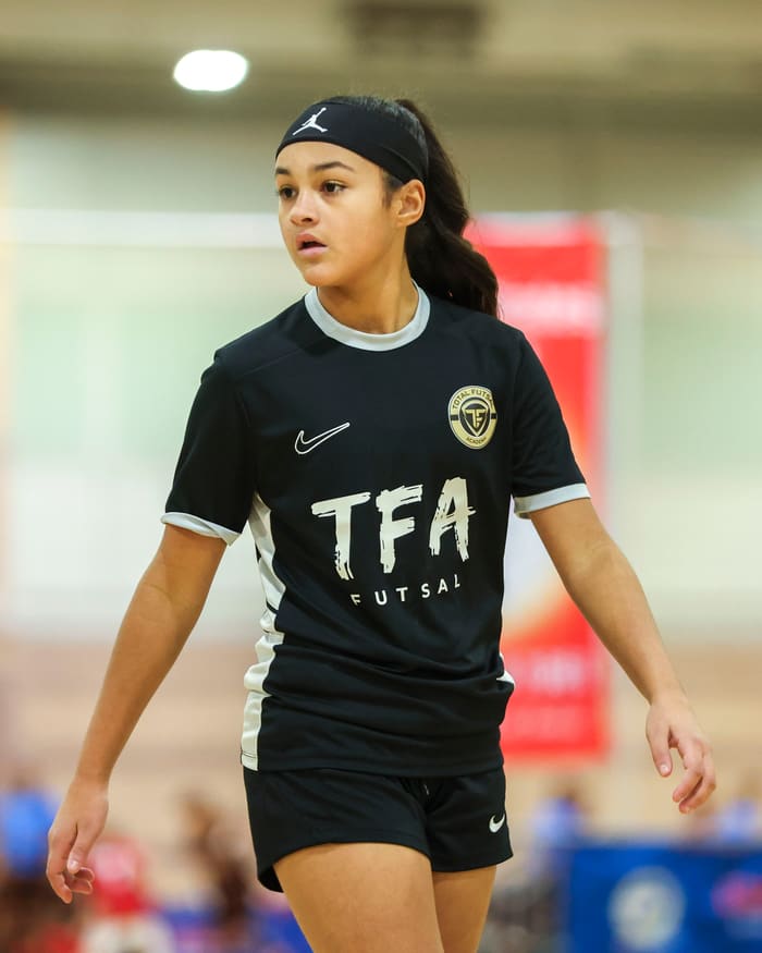 A player walking the court with focus and confidence